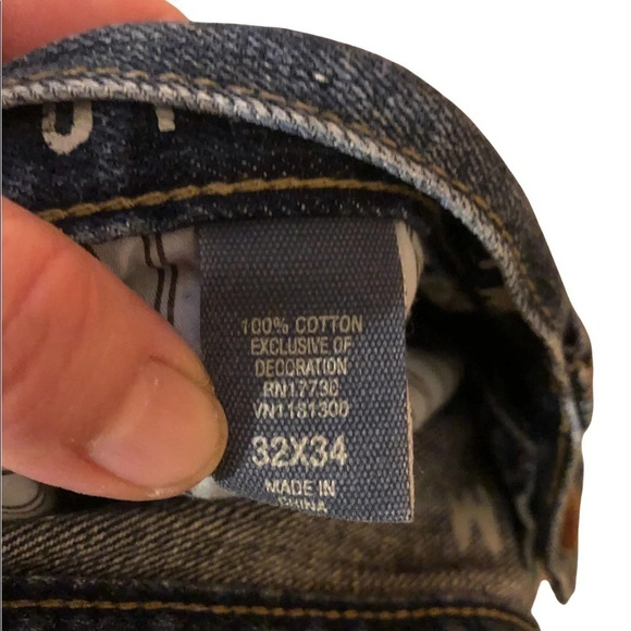 Distressed slim fit tapered jean - Picture 3 of 9